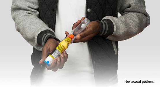 Person holding auto injector