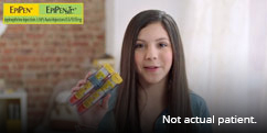 Girl holding auto injectors