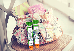 Image of handbag next to two auto injector devices Image of handbag next to two auto injector devices
